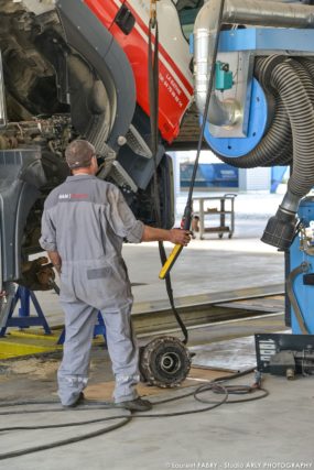 Photographe industriel dans l'atelier : véhicules de transport routier Man Truck & Bus Center
