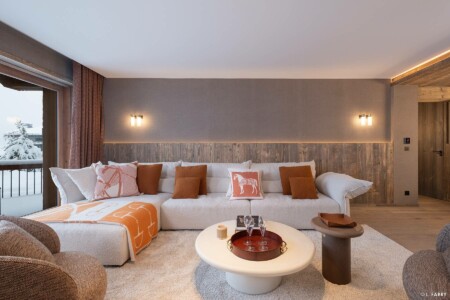 Photographie immobilière à Courchevel : salon d'un appartement dans le chalet le Manej